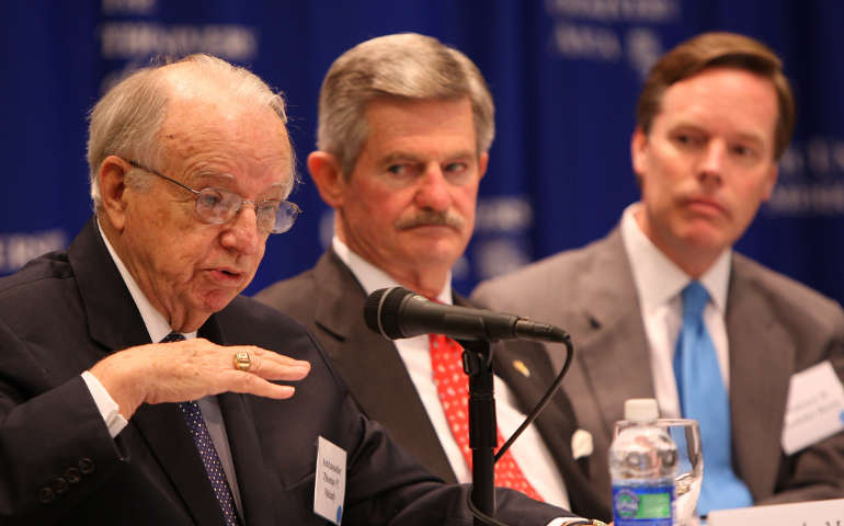 Thomas Melady gestures during a symposium at The Catholic University of America in Washington May 28, 2009. Looking on is Jim Nicholson, who also is a former U.S. ambassador to the Vatican, and Nicholas Burns, a former high ranking State Department official. (CNS file photo)