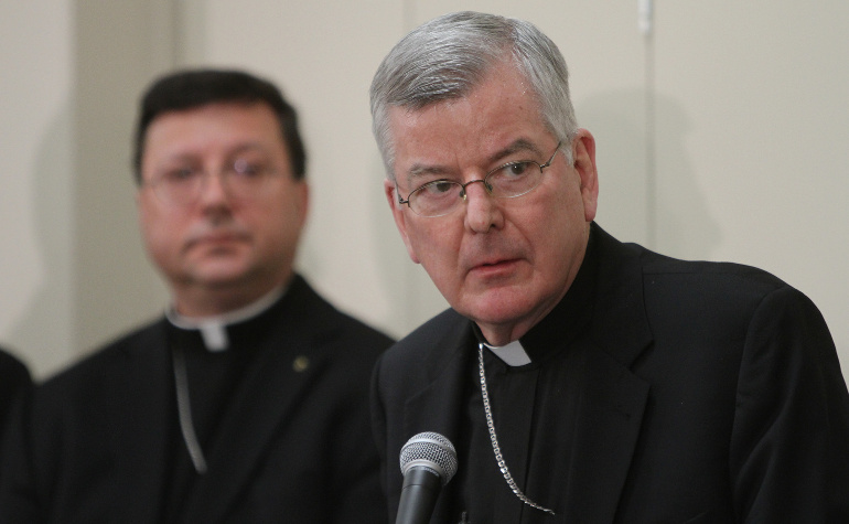Archbishop John C. Nienstedt, right, addresses the media alongside Auxiliary Bishop Lee A. Piche at a news conference Jan. 16 announcing that the archdiocese had filed for Chapter 11 Reorganization. (CNS/Dave Hrbacek)