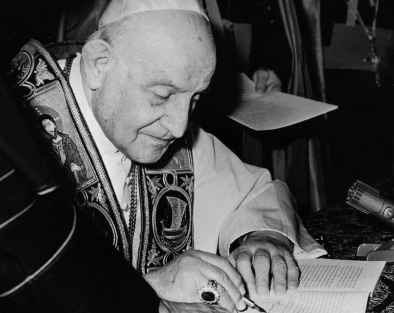 Pope John XXIII signing Pacem in Terris (CNS photo)