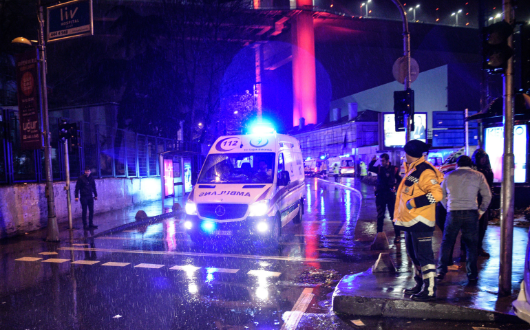 Ambulances transport people wounded during an attack on a New Year's Eve celebration at a popular nightclub in Istanbul. At least 39 people, mostly foreigners, were killed and dozens injured in the attack. (CNS photo/EPA)