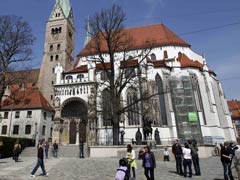 People stroll around the cathedral in Augsburg, Germany, in April 2010. (Reuters/Michael Dalder)