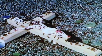 A clip of ants crawling over a crucifix is seen in artist David Wojnarowicz's video "A Fire in My Belly." (UPI/Roger L. Wollenberg)