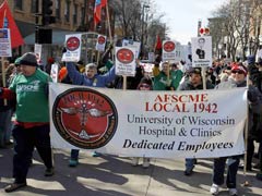 Thousands of demonstrators gather at the Wisconsin State Capitol Building in Madison March 12 for a rally to protest passage of Gov. Scott Walker's bill curbing public employees' collective bargaining rights. (Reuters/Allen Fredrickson)