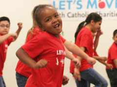 Kids join in the filming of Catholic Charities' video for BeyoncÈ's Let's Move anthem, "Move Your Body." (Jennifer Sirota)