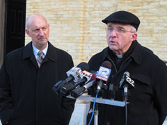 In December, Fr. James Connell speaks at a Milwaukee news conference of the Survivors Network of those Abused by Priests as the group's Midwest director, Peter Isely, looks on. (AP photo/Dinesh Ramde)