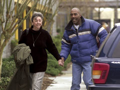 Marie Deans walks to a new conference with Earl Washington Jr. in Virginia Beach, Va., on Feb. 12, 2001, the day he was released from prison. (Newscom/Richmond Times Dispatch/Alexa Welch Edlund)