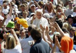 Pope Benedict XVI waves as he arrives to lead his general audience in St. Peter's Square at the Vatican June 3. (CNS/Reuters/Giampiero Sposito)
