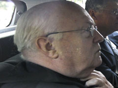 Cardinal Godfried Danneels arrives at Belgian federal police headquarters in Brussels July 6. (CNS/Reuters)