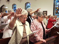 Presentation of the Blessed Virgin Mary Sr. Christine Liegey prays during a June 26 service at St. Mary's Church in Pompton Lakes, N.J., held in support of U.S. women religious. (CNS/Octavio Duran)
