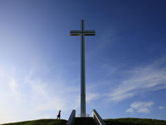 A man walks past the Papal Cross, which was built for the visit of the late Pope John Paul II in September 1979, in Phoenix Park, in Dublin, Ireland. (Newscom/Getty Images/AFP/Peter Muhly)