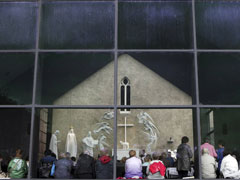 Parishioners and visitors attend Mass at a Roman Catholic church in the village of Knock, County Mayo, in this photo taken May 29, 2010. (Newscom/RTR/Cathal McNaughton)