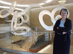 Daughter of Charity Sr. Ellen LaCapria in front of St. Agnes Hospital's hanging sculpture, "Spun Grace" (Photos by Alice Popovici)