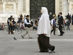 A Muslim woman walks through the Piazza del Duomo in Milan, Italy, in October 2009. (Reuters/Alessandro Garofalo)
