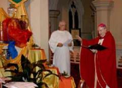 Fr Jim Cronin (left) and Bishop Bill Morris (right) blessing symbols of Baptism during the Mass opening the Fifth Diocesan Gathering July 12, 2010 in St Patrick's Cathedral Centre, Toowoomba, Australia. The theme of the gathering was "Church in the Third Millennium: Ministry, Mission and Maintenance."