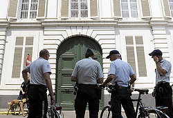 Police officers stand outside the residence of the archbishop of Mechelen-Brussels in Mechelen, Belgium, in 2010. Belgian investigators searched the headquarters of the Belgian Catholic Church, the archbishop's residence as well as the home of Cardinal Godfried Danneels as part of an investigation into alleged priestly sexual abuse. (CNS photo/Eric Vidal, Reuters)