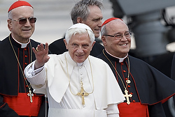 Pope Benedict XVI waves as he arrives Tuesday at Jose Marti International Airport in Havana. Behind the pope is Cardinal Tarcisio Bertone, the Vatican Secretary of State, and Cardinal Jaime Ortega Alamino of Havana. (CNS photo/Paul Haring)