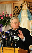 Bishop David L. Ricken of Green Bay, Wis., answers reporters' questions following Mass Dec. 8 at the Shrine of Our Lady of Good Help in Champion, Wis. (CNS photo/Sam Lucero, The Compass)