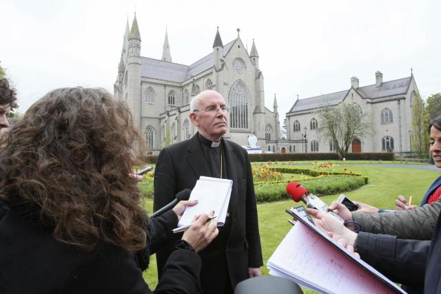 Cardinal Se·n Brady of Armagh speaks to members of the media May 2 outside the Armagh cathedral in Northern Ireland. (CNS/Reuters)