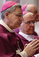 Bishop Robert W. Finn of Kansas City-St. Joseph, Mo., is seen concelebrating Mass March 12 with other bishops from Iowa, Nebraska, Kansas and Missouri at the tomb of Blessed John Paul II in St. Peter's Basilica during "ad limina" visits to the Vatican. (CNS photo /Paul Haring)