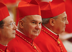 U.S. Cardinal John P. Foley sits among other cardinals after receiving his red biretta from Pope Benedict XVI during a consistory in St. Peter's Basilica at the Vatican on Nov. 24, 2007. (CNS photo/Paul Haring)