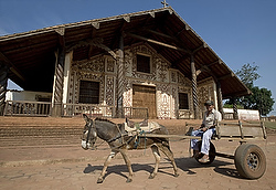 A man rides a cart past San Miguel de Velasco Church, a Catholic mission in Bolivia's Santa Cruz province, in this 2010 photo. (CNS photo/Reuters)