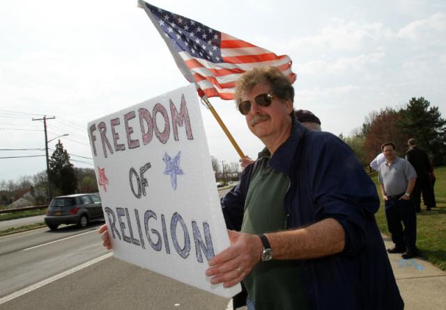 William Stysiack of Our Lady of Perpetual Help Parish in Lindenhurst, N.Y., participates in a "Stand Up for Religious Freedom" rally near the offices of U.S. Sens. Charles Schumer and Kirsten Gillibrand in Melville, N.Y., March 23. (CNS/Long Island Catholic/Gregory A. Shemitz)