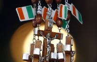 Rosaries tagged with Irish flags hang in a religious shop in Knock, Ireland, June 10, 2009. (CNS photo/Cathal McNaughton, Reuters)