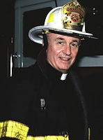 Franciscan Father Mychal Judge, a chaplain with the New York Fire Department, is pictured in an undated photo wearing his helmet and bunker coat. (CNS photo/courtesy Holy Name Province Franciscans)