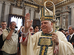 Cardinal Bernard F. Law blesses people after celebrating Mass at the Basilica of St. Mary Major to mark the feast of the church's dedication Aug. 5, 2010, in Rome. (CNS photo/Paul Haring)