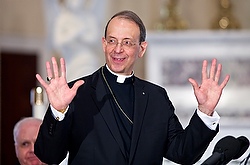 Archbishop William E. Lori smiles as he accepts applause during a press conference March 20 at the Basilica of the National Shrine of the Assumption of the Blessed Virgin Mary in Baltimore. (CNS/Catholic Reivew/Tom McCarthy Jr.)