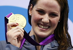 Missy Franklin of the U.S. poses with her gold medal after winning the women's 100 backstroke final Monday at the London 2012 Olympic Games at the Aquatics Center. Franklin is a senior at Regis Jesuit High School in Aurora, Colo., in the Denver Archdiocese. (CNS/Reuters/David Gray)