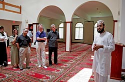 Imam Muhammad Asil Khan explains topics of Islamic prayer to a group of Catholics organized by Atonement Father James J. G ardiner at Masjid Al-Noor Mosque in Wappingers Falls, N.Y., July 28, 2007. (CNS photo/Jillian Murphy)