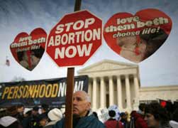 A man holds an anti-abortion sign outside the U.S. Supreme Court during the 37th annual March for Life in Washington Jan. 22. (CNS photo/Molly Riley, Reuters)