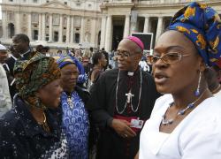 Archbishop Anthony Obinna of Owerri, Nigeria, mingles with pilgrims at the Vatican Oct. 25. (CNS/Paul Haring)