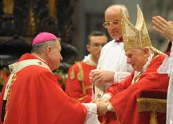 Pope Benedict XVI greets U.S. Archbishop Gregory M. Aymond of New Orleans after presenting a pallium to him during a Mass in St. Peter's Basilica at the Vatican June 29.