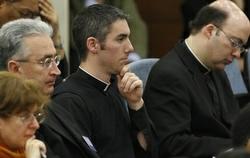 Deacon John Burns, a seminarian from the Archdiocese of Milwaukee, center, attends a theological conference on priestly celibacy at the Pontifical University of the Holy Cross in Rome March 4. Burns and several other seminarians from the Pontifical North American College attended the two-day conference. (CNS photo/Paul Haring