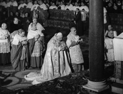 Pope John XXIII prays in the Basilica of St. Paul Outside the Walls on Jan. 25, 1959, just before announcing his plans to convoke the Second Vatican Council. The pope cited a need to update the church and promote Christian unity. (CNS file photo)