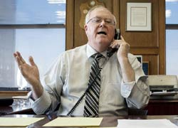 Catholic League president Bill Donohue making a point on the telephone in his office.
