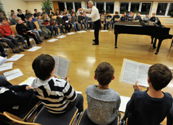 Students practice for a Christmas concert at the Regensburger Domspatzen in Regensburg, Germany, last Nov. 27. The boarding school trains the elite boys' choir of the Regensburg Cathedral. Authorities were investigating claims of sexual abuse that may ha ve occurred decades ago at the school. (CNS photo/KNA-Bild)