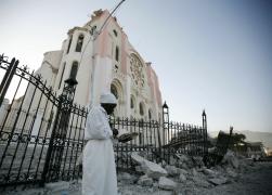 A Haitian woman outside the ruins of the Cathedral of Our Lady of the Assumption in Port-au-Prince, Haiti, Jan. 23. (CNS /Tomas Bravo, Reuters)