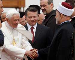 Pope Benedict XVI, standing next to Jordan's King Abdullah II, center, is greeted by a Muslim sheikh upon his arrival at Queen Alia International Airport in Amman, Jordan, May 8. (CNS/Reuters)