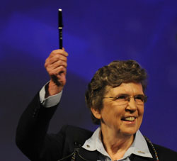 Sr. Carol Keehan, president and CEO of the Catholic Health Association, holds up a pen used by President Obama to sign the health care reform bill into law. (CNS/courtesy Catholic Health Association)