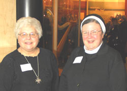 Apostolic visitator Mother Mary Clare Millea (right) and president of the Leadership Conference of Women Religious Franciscan Sr. Marlene Weisenbeck at a Jan. 14 reception opening the "Women & Spirit: Catholic Sisters in America" exhibit at the Smithsonian Institution in Washington. (Ben Sullivan)