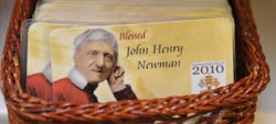 A card with an image of Cardinal John Henry Newman displayed in a papal memorabilia stand next to Westminster Cathedral in central London Sept. 15. (CNS/Reuters)