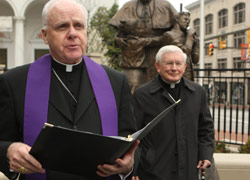 Archbishop Edwin O'Brien and Cardinal William H. Keeler at an April 2 prayer service. (CNS)