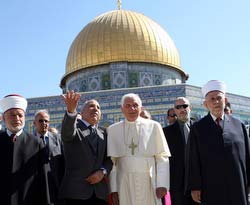 Pope Benedict XVI stands in front of the Dome of the Rock, on the compound known to Muslims as Noble Sanctuary and to Jews as Temple Mount, in the Old City of Jerusalem May 12. The pope removed his shoes before entering the Dome of the Rock, a seventh-century shrine that protects an exposed rock revered by Muslims as the place from which Mohammed ascended to heaven.