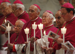 Prelates hold candles during Pope Benedict XVI's celebration of the Easter Vigil in St. Peter's Basilica at the Vatican April 3. (CNS photo/Paul Haring)