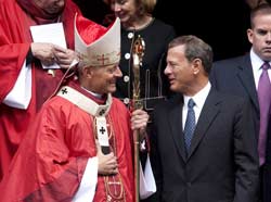 Archbishop Donald W. Wuerl of Washington and Chief Justice John Roberts leave the Cathedral of St. Matthew the Apostle in Washington following the Red Mass Oct. 3. (CNS)