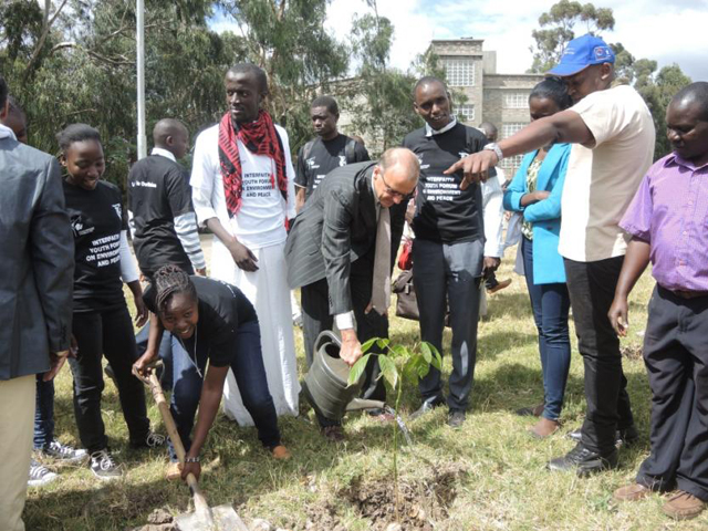 Participants at the second annual environmental awareness conference for Kenyan youth plant a tree together. (GSR/Melanie Lidman)