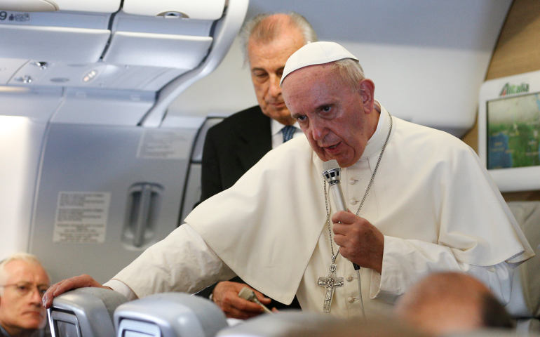 Pope Francis and journalists fly back to Rome from Africa Nov. 30. (CNS/Paul Haring)